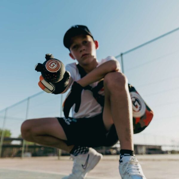 hand tennis player showing off hand tennis ball